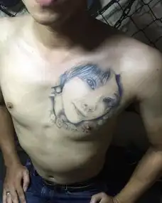 泰国男子将前任女友纹身改成狗